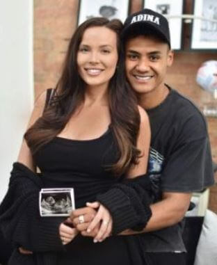 Ollie Watkins with his girlfriend Ellie Aldreson flaunting the ultrasound picture.